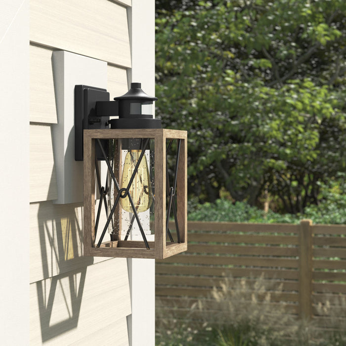 1-Light Black and Faux Wood Motion Sensor and Dusk to Dawn Outdoor Wall Sconce with Clear Seeded Glass