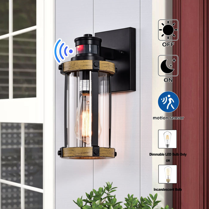 cattleyalighting 1-Light Black and Woodgrain Motion Sensor Dusk To Dawn Outdoor Wall Sconce With Striped Clear Glass