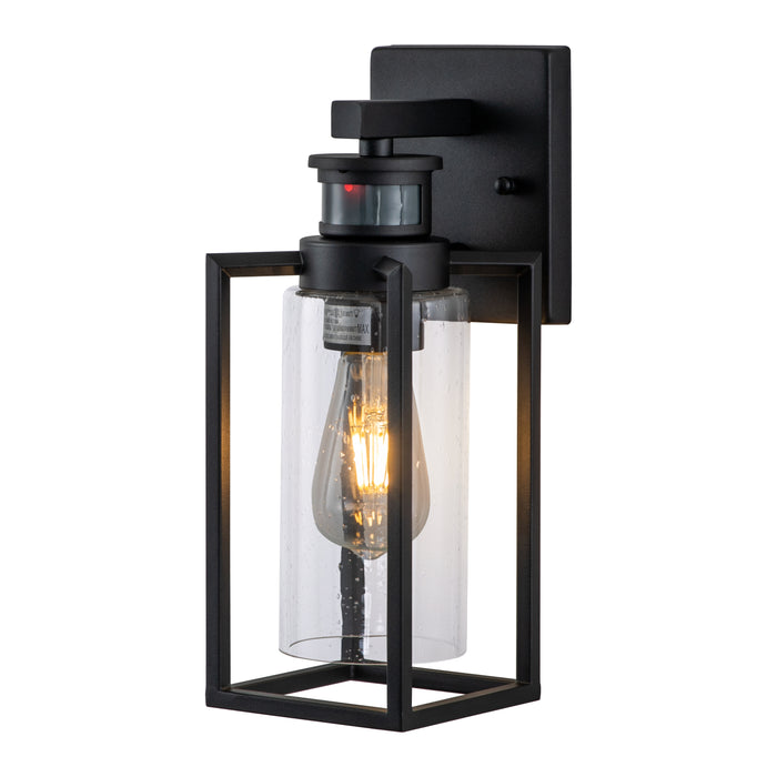 1-Light Matte Black Motion Sensing Dusk to Dawn Outdoor Wall Lanten with Clear Seeded Glass Cylinder