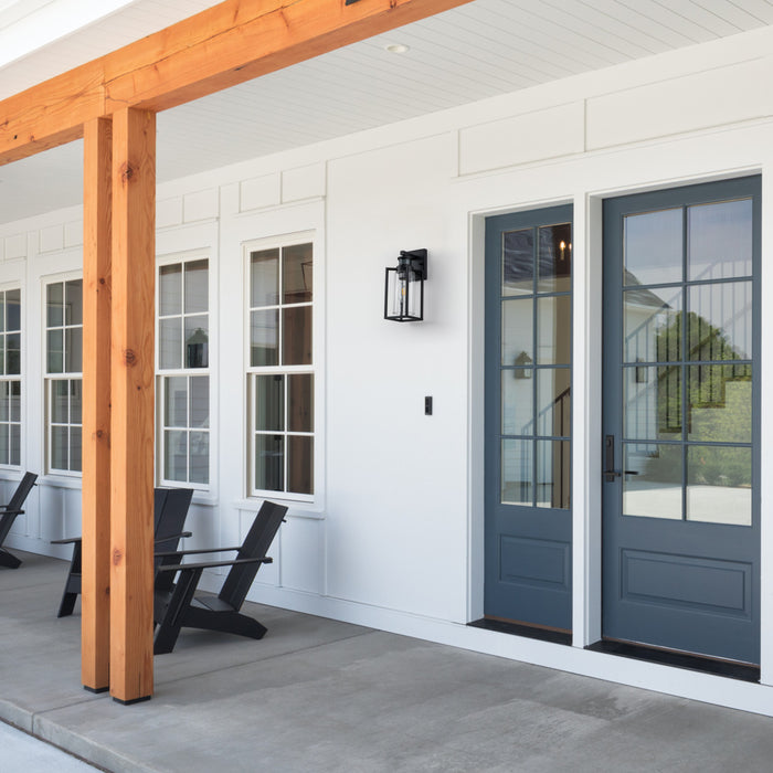 1-Light Matte Black Motion Sensing Dusk to Dawn Outdoor Wall Lanten with Clear Seeded Glass Cylinder